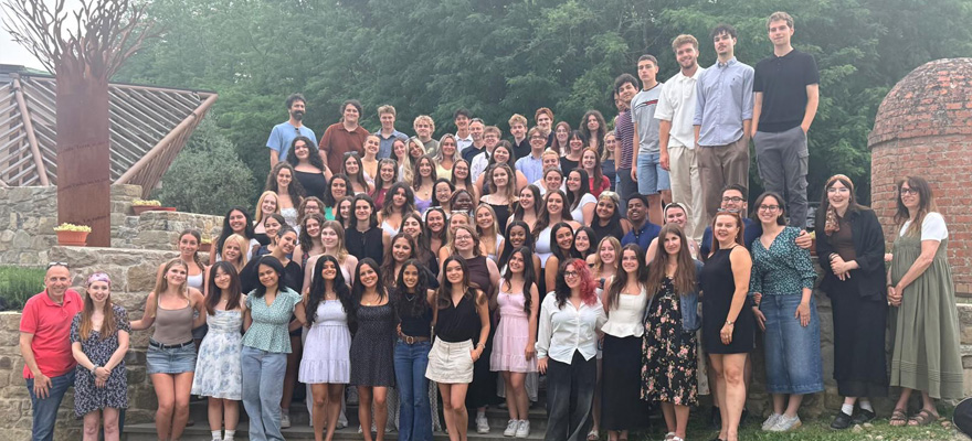 Students standing and smiling